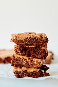Four squares of brownies stacked on top of each other