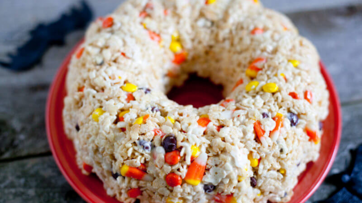 Halloween Rice Krispie Treat Cake sitting on a red plate