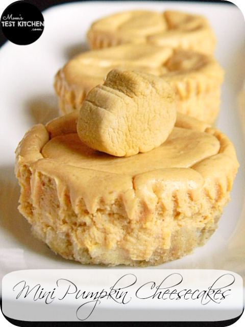 Three mini pumpkin cheesecakes on a white plate. Image is labeled with recipe title