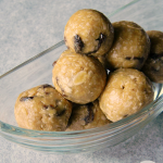 A clear bowl piled with no-bake oatmeal cookie energy balls
