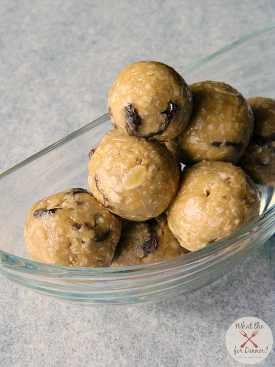 A clear bowl piled with no-bake oatmeal cookie energy balls