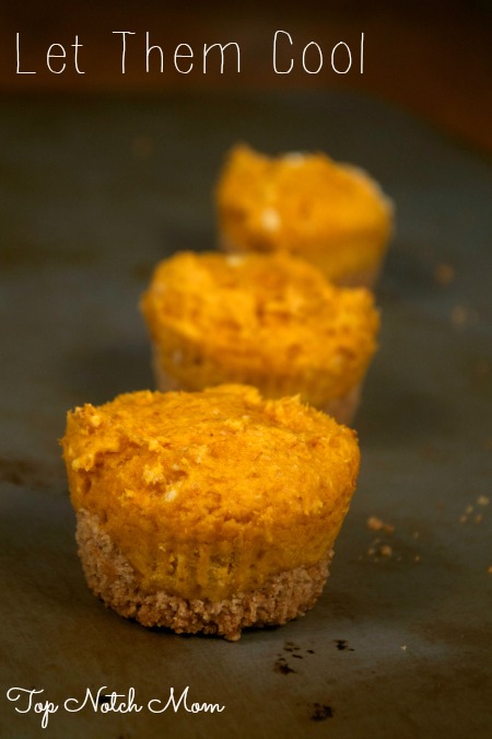 Three Pumpkin Muffins cooling on a tray