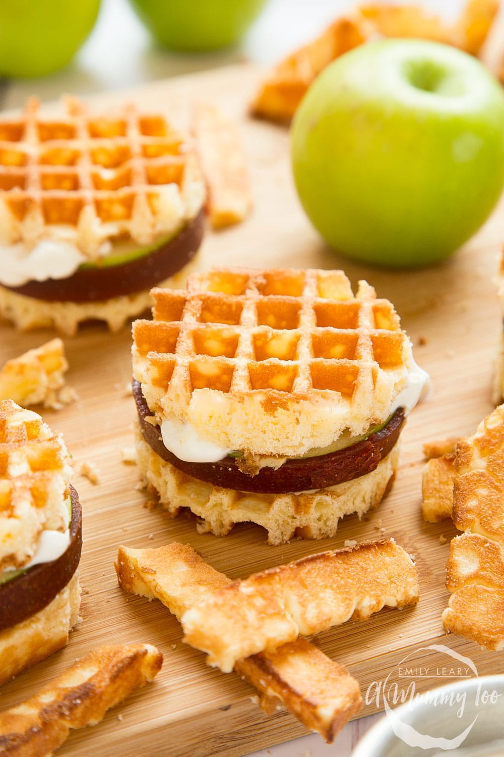 Waffle Apple 'Hamburgers' on a butcher block with green apple