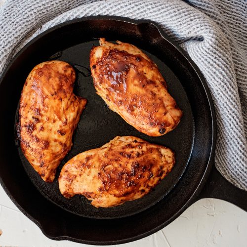 Three Chicken breasts in a cast iron skillet