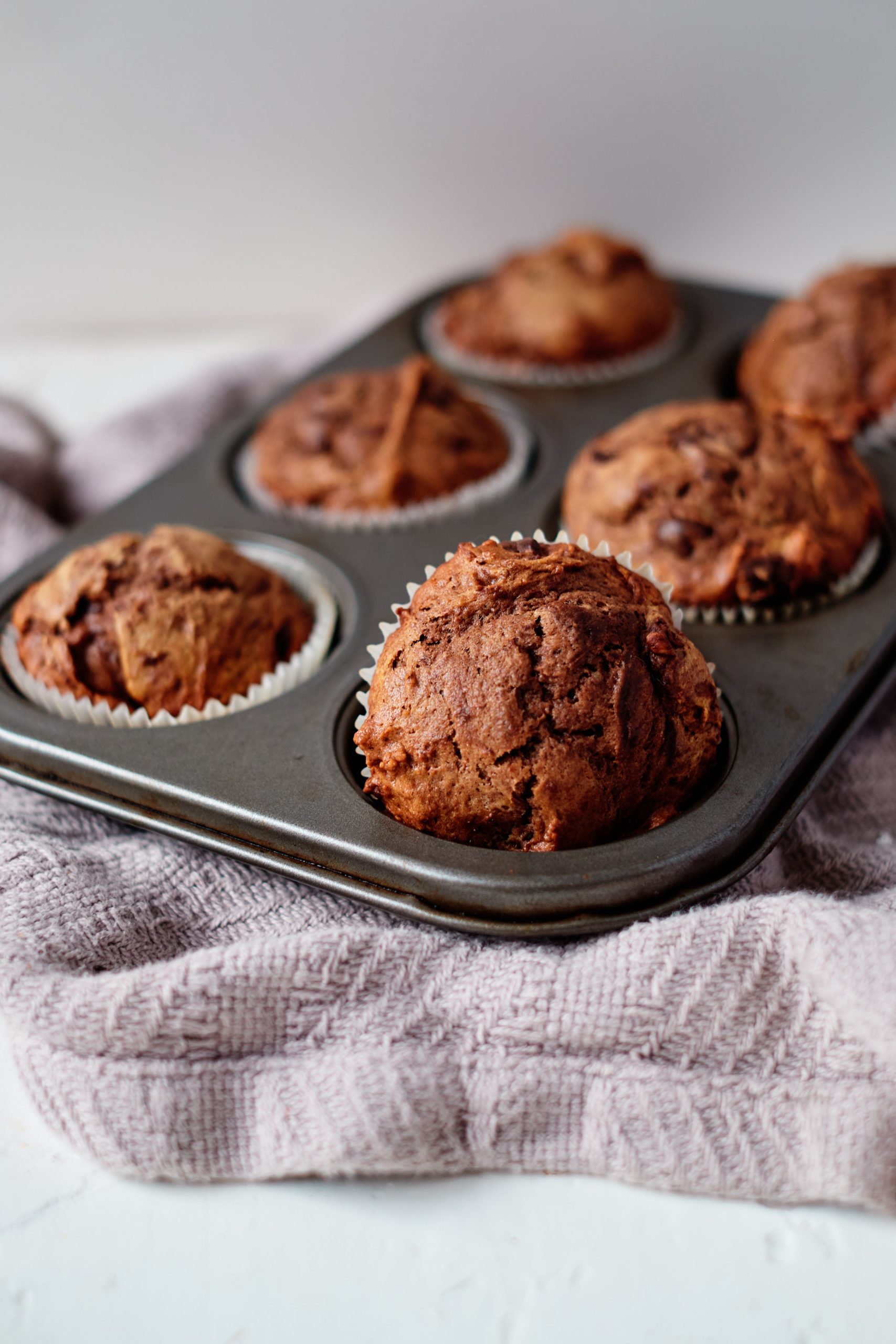 Double Chocolate Peanut Butter Muffins in a six count muffin tin