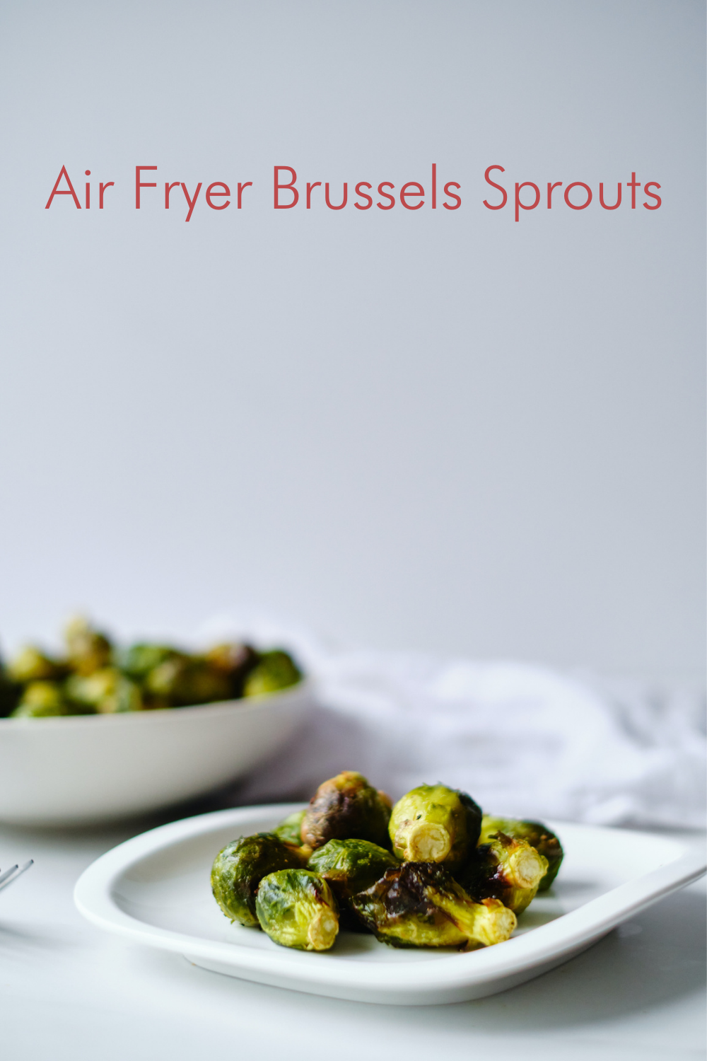 No bells and whistles needed with this simple, delicious Air Fryer Brussels Sprouts recipe. You get crispy and perfectly golden brown sprouts every time!