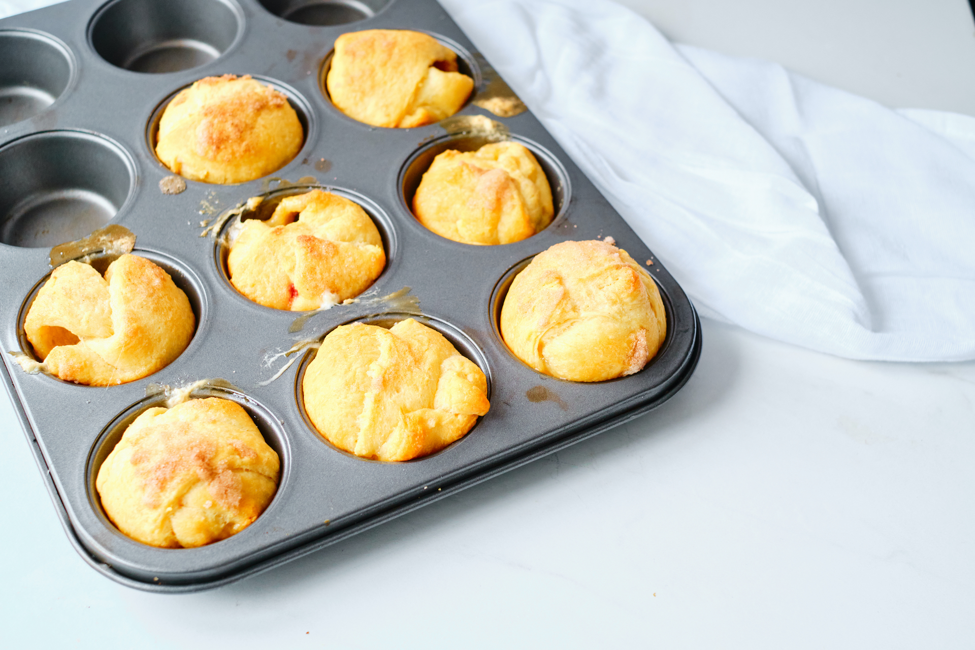 cooked rolls in a muffin tin