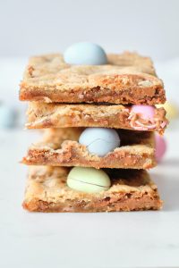 four mini egg cookie bars stacked on top of each other